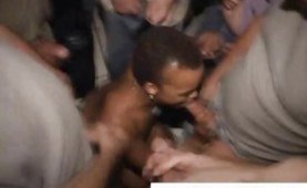Short haired ebony at a bukkake blowjob party